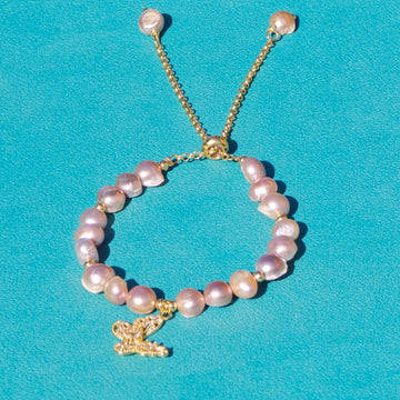 Adjustable Pearl bracelet with a butterfly charm