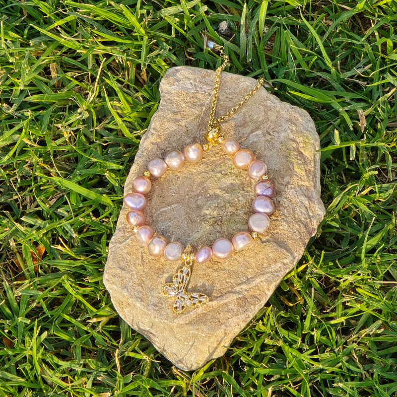 Adjustable Pearl bracelet with a butterfly charm