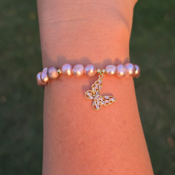 Adjustable Pearl bracelet with a butterfly charm