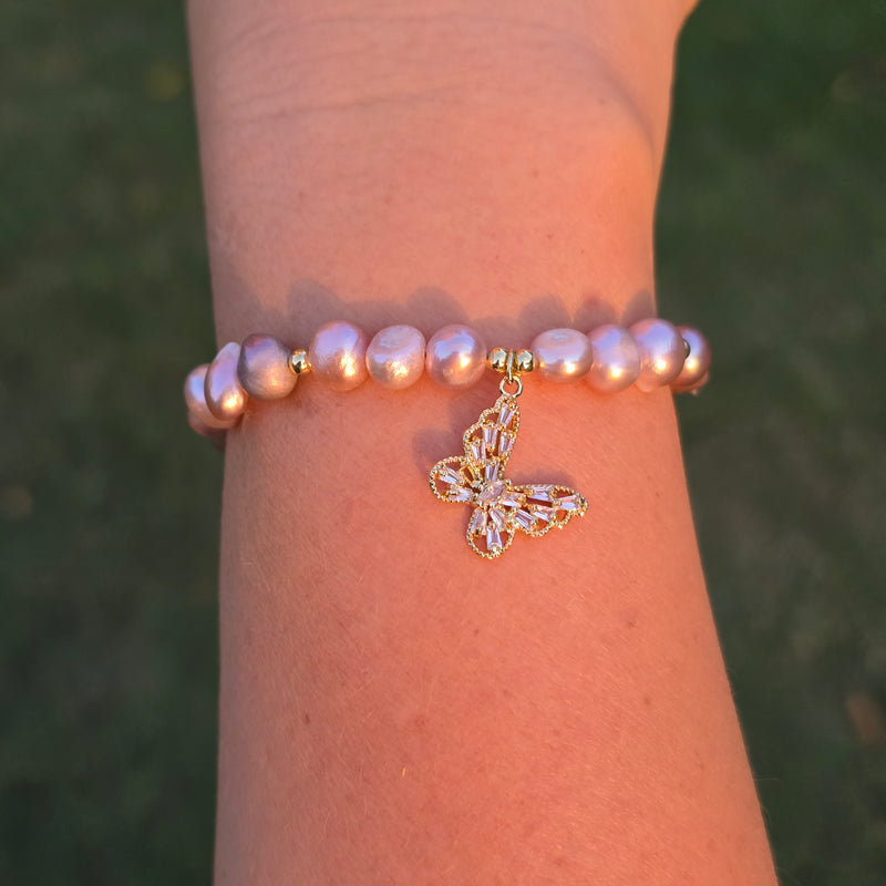 Adjustable Pearl bracelet with a butterfly charm