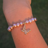 Adjustable Pearl bracelet with a butterfly charm