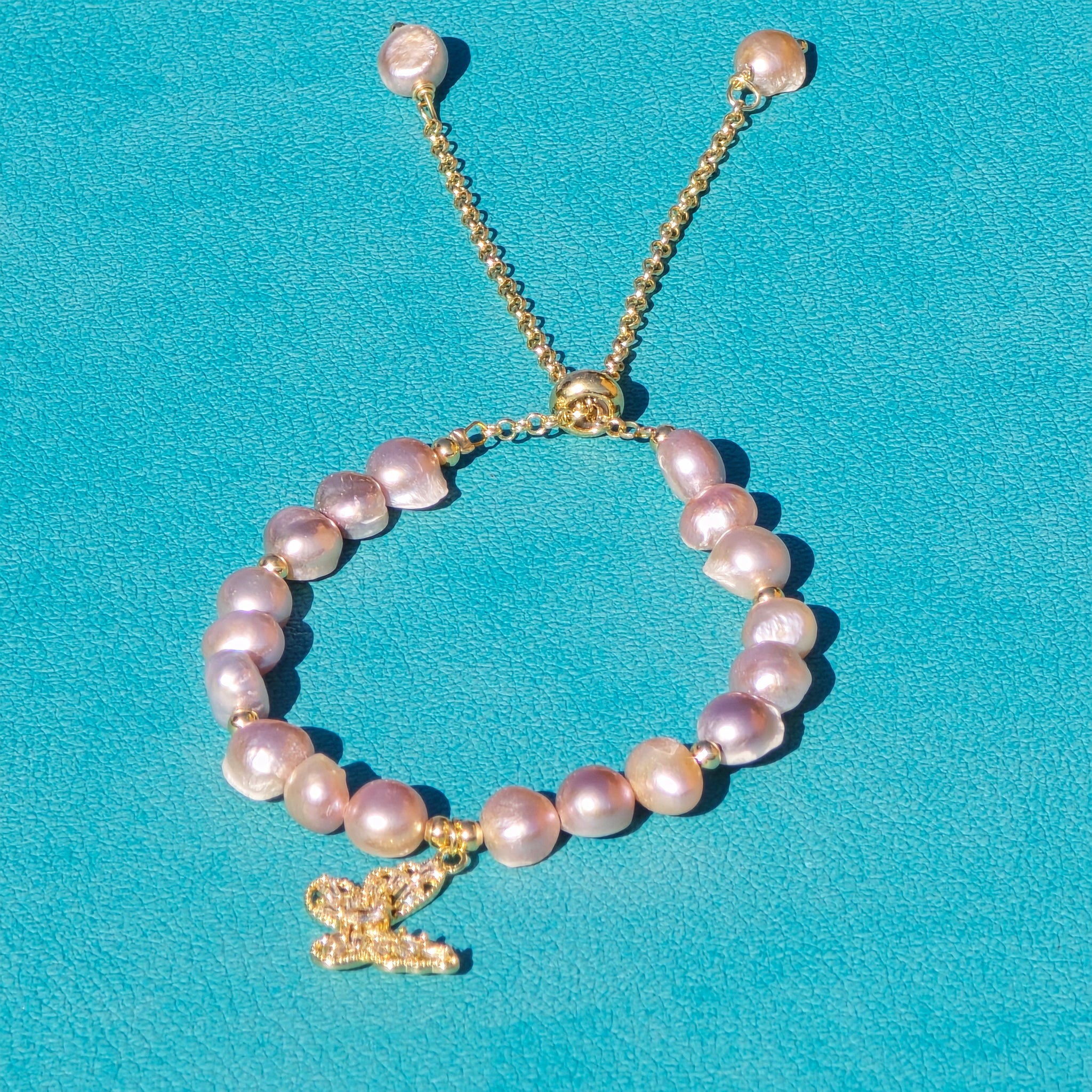 Adjustable Pearl bracelet with a butterfly charm