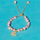 Adjustable Pearl bracelet with a butterfly charm