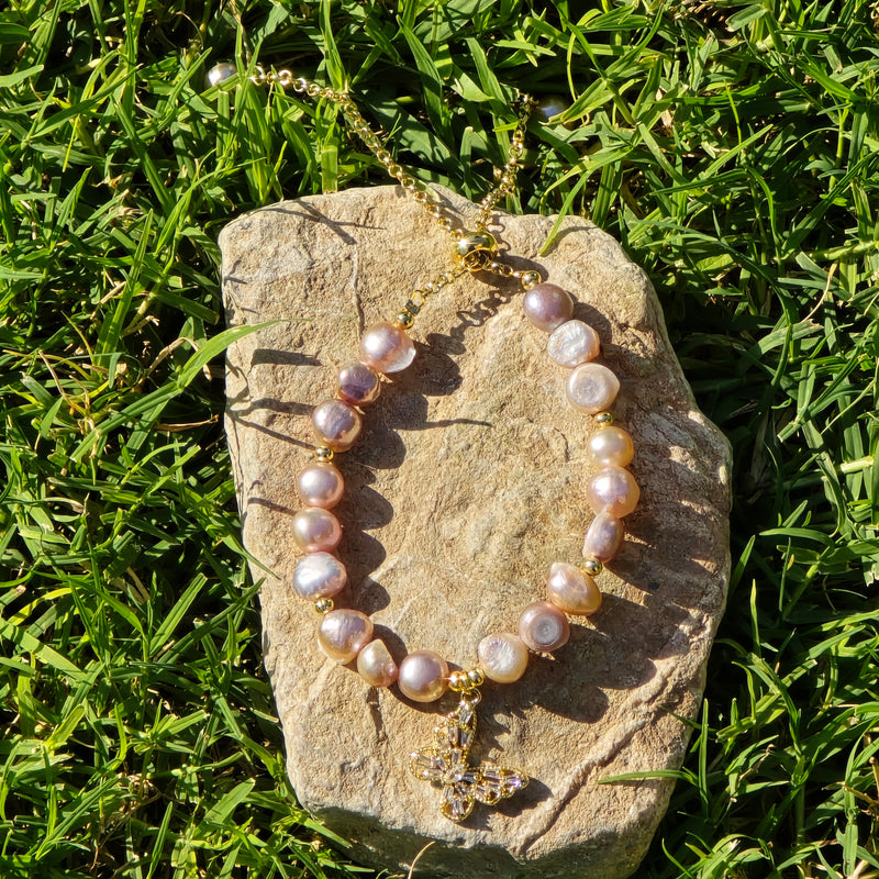 Adjustable Pearl bracelet with a butterfly charm